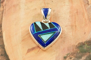 Genuine Blue Lapis and Black Jade inlaid in Sterling Silver Heart Pendant. Beautiful Fire and Ice Lap Opal Accents. Free 18" Sterling Silver Chain with Purchase of Pendant. Designed by Navajo Artist Calvin Begay. Signed 